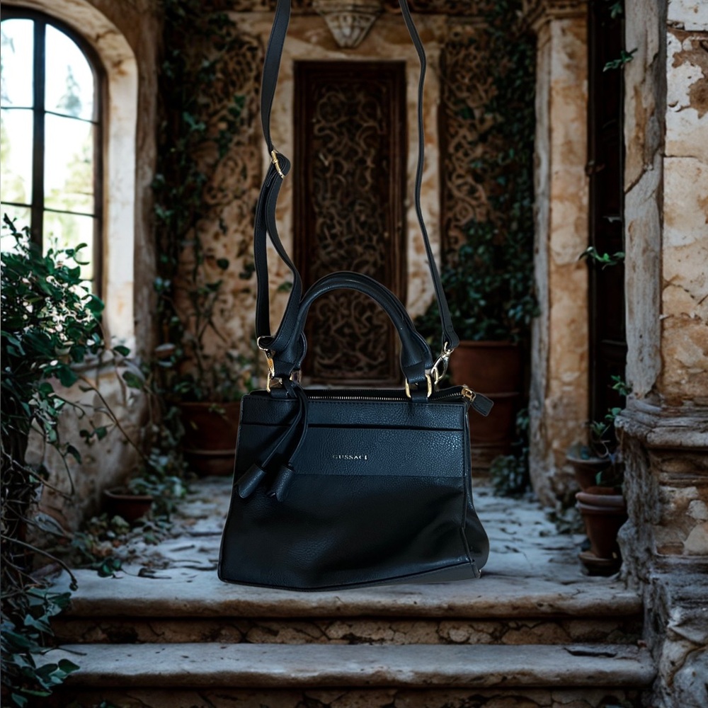 Gussaci Black leather shoulder bag with gold hardware and tassels